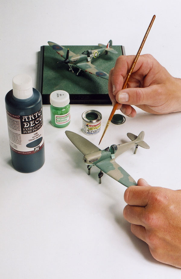 All of our aircraft and tanks are hand painted by our highly skilled painters using a combination of acrylic and enamel paints. Many of the colours for camouflage of the aircraft and tanks are mixed by ourselves and matched to authentic paint chips.